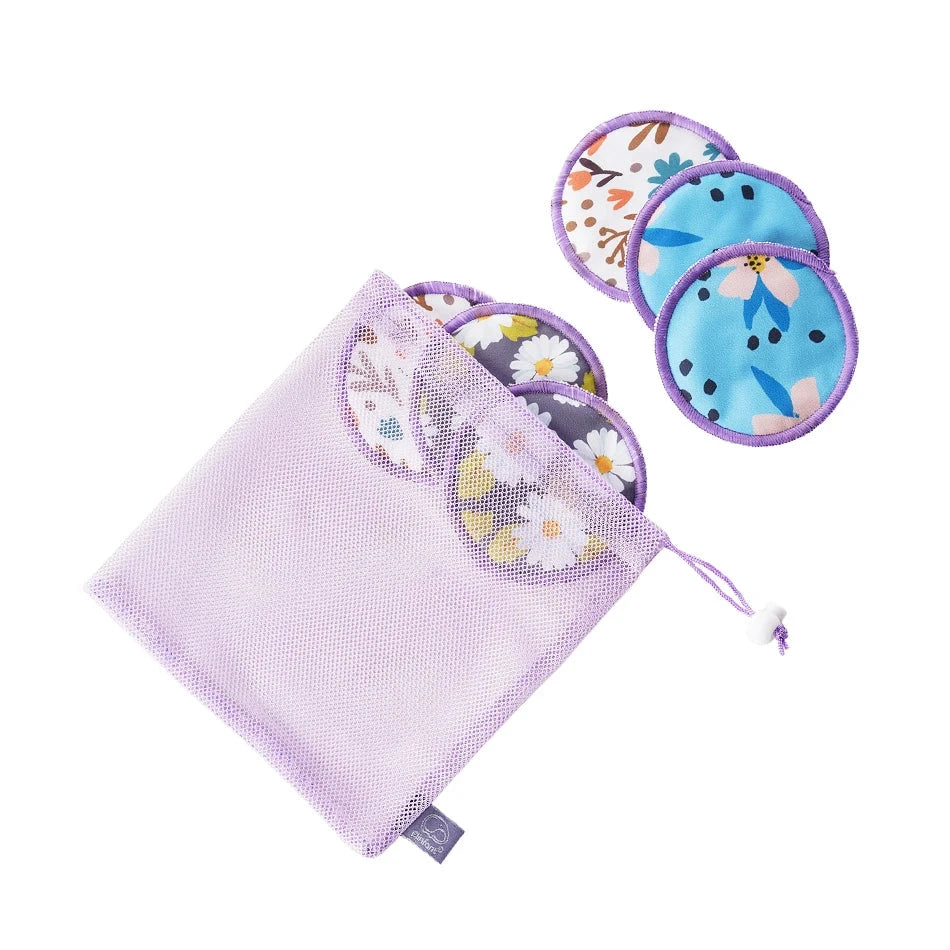 A set of reusable menstrual pads with floral patterns and a lavender mesh drawstring bag, shown on a white background with the Elifant brand logo in the top left corner.