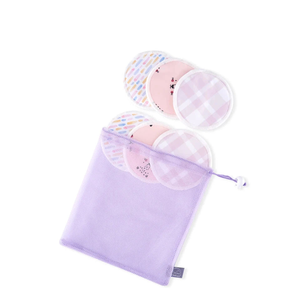 A lavender mesh drawstring pouch containing three round reusable pads with pastel patterns and pink gingham designs, shown on a white background with a model number label 'ES067-N' at the top.