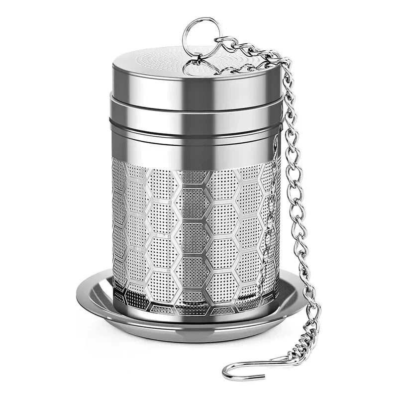 Stainless steel tea infuser with chain on a white background