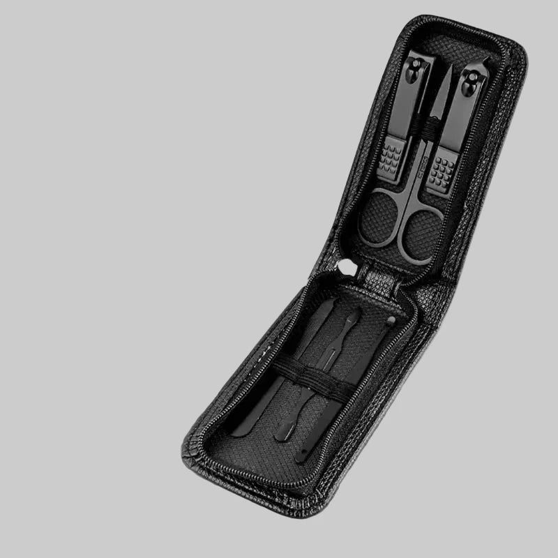 Black nail care set with tools in a case on a white background