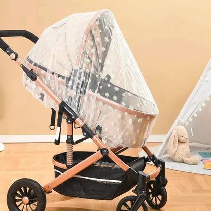A stroller with a clear mosquito net canopy draped over it, shown in a baby room setting with a wooden floor and a small white teepee tent in the background. The text 'Stroller Mosquito Net' is visible at the top right.